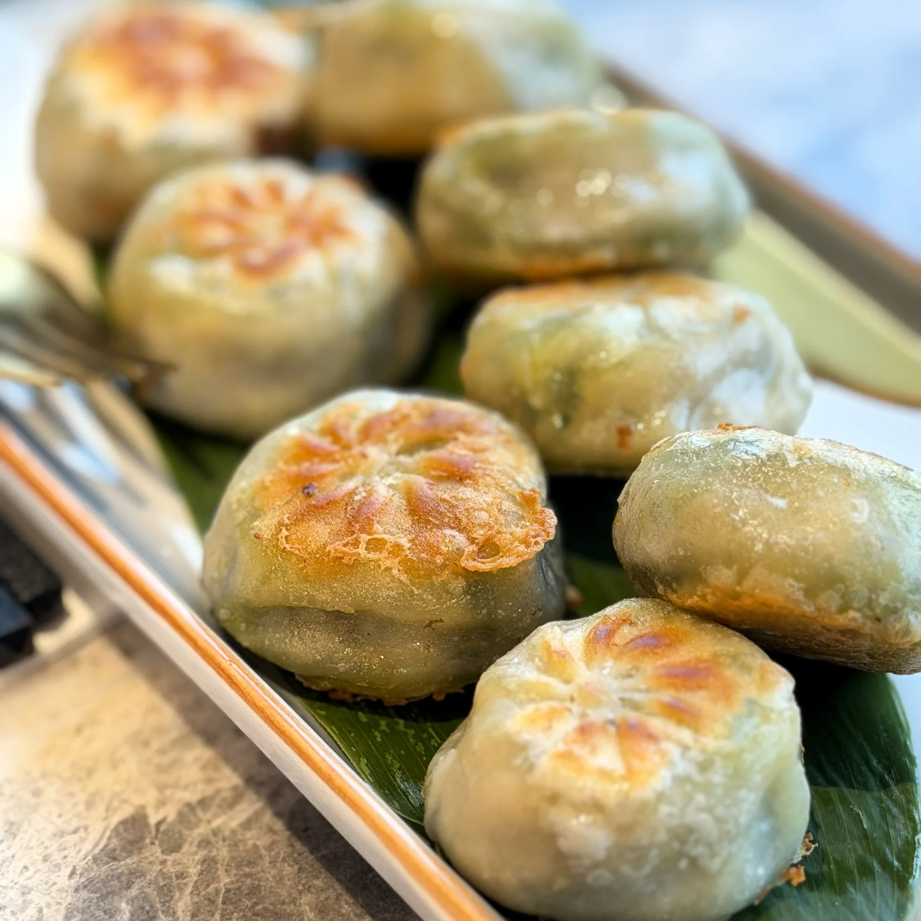 Mini pan-fried chive pies with crisp golden bases