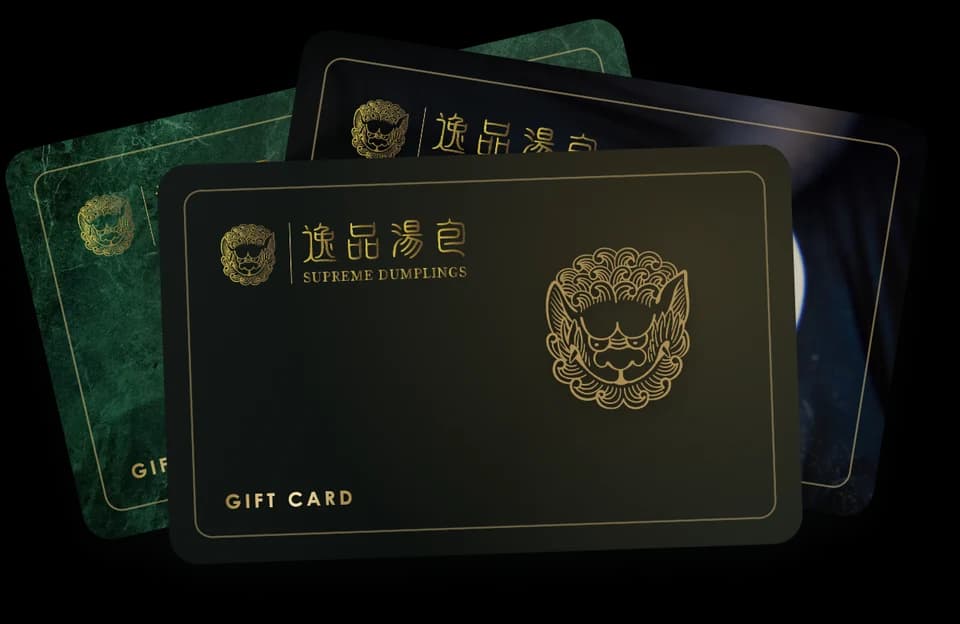 Supreme Dumplings gift cards in jade, Xiao Long Bao and gold lion designs