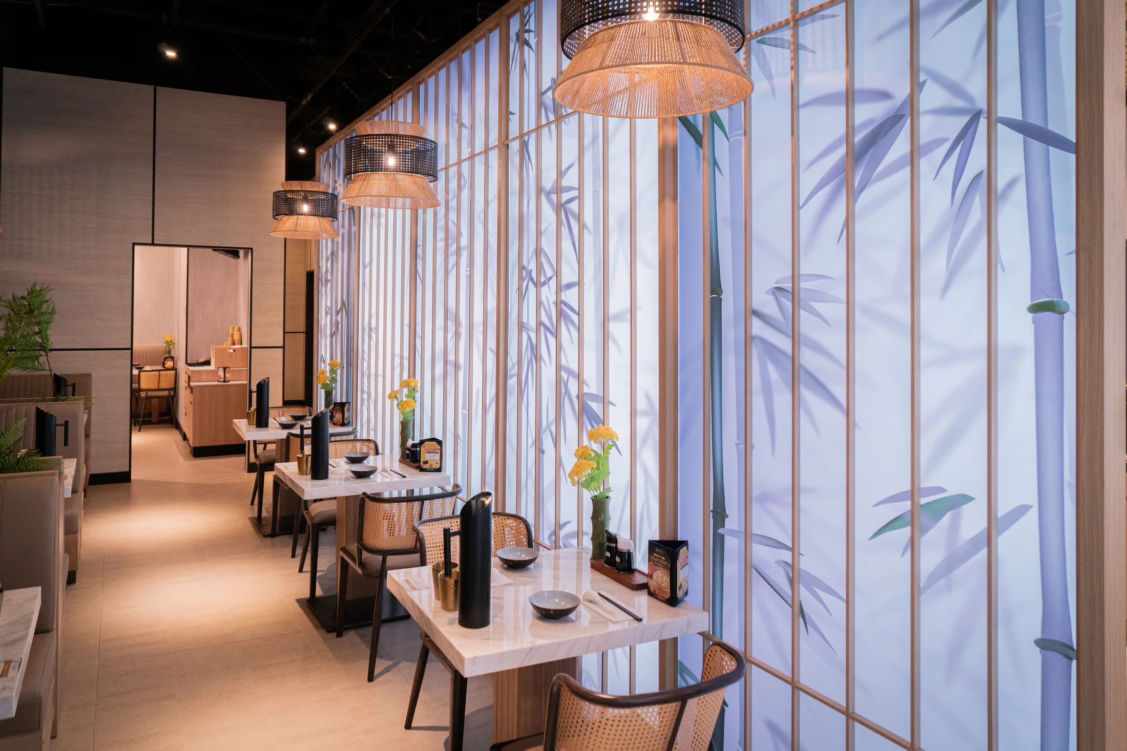 A long view through a warm Supreme Dumplings dining room