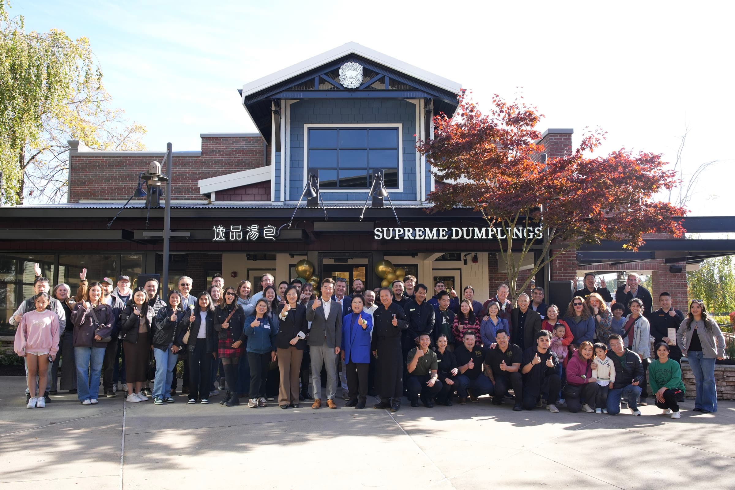 The Supreme Dumplings team gathered outside the Alderwood restaurant